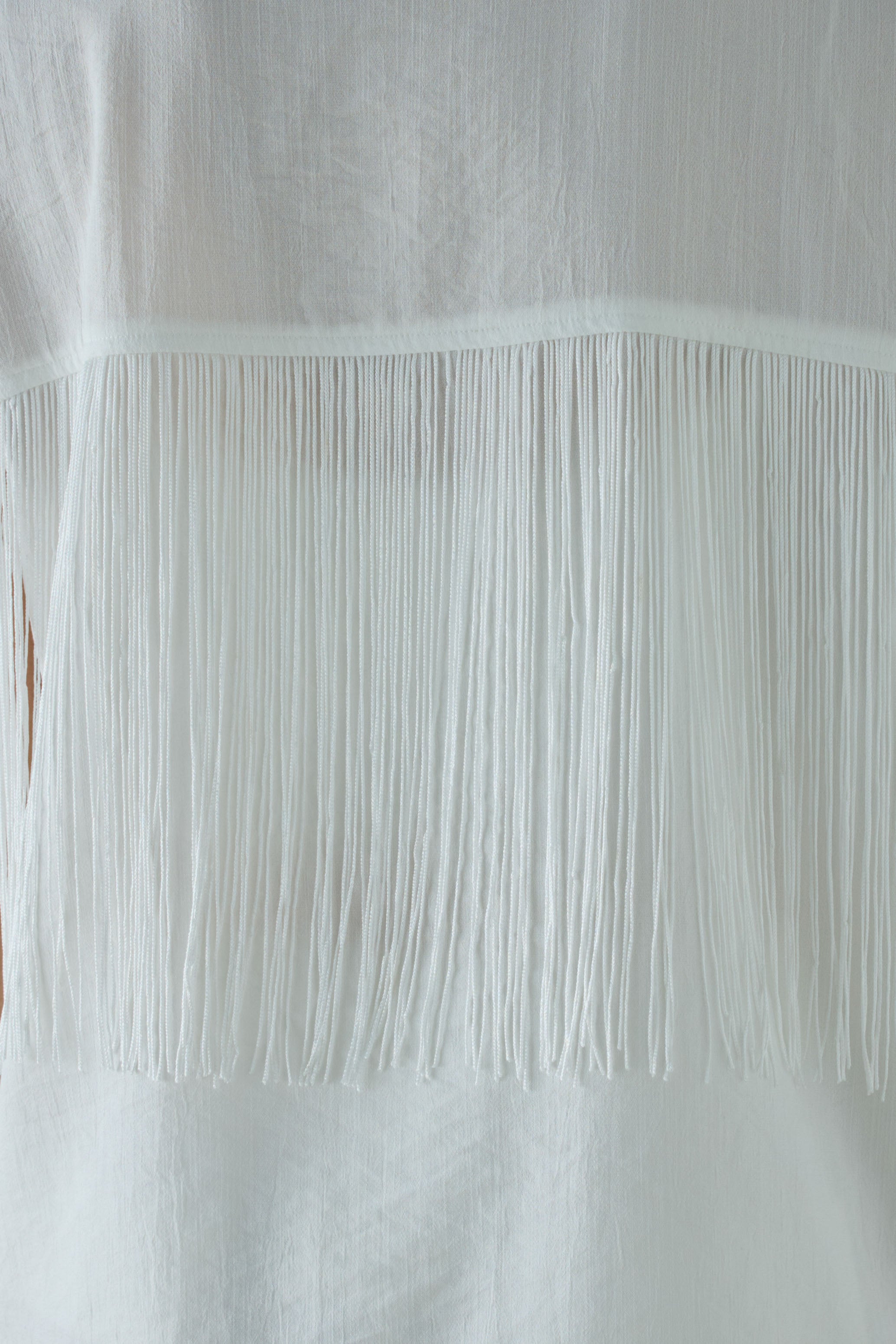 フリンジデザイン ホワイトノースリーブ